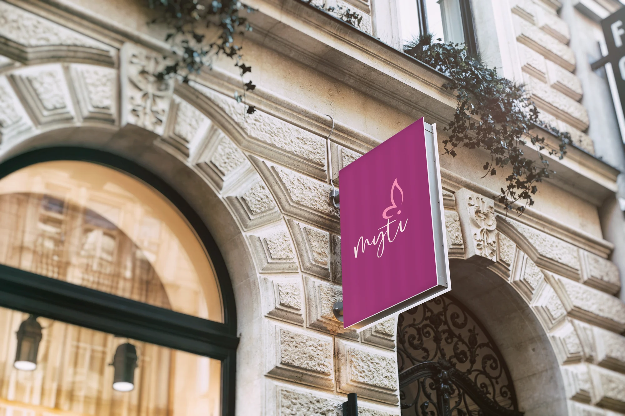 Myti sign on a stone shop front